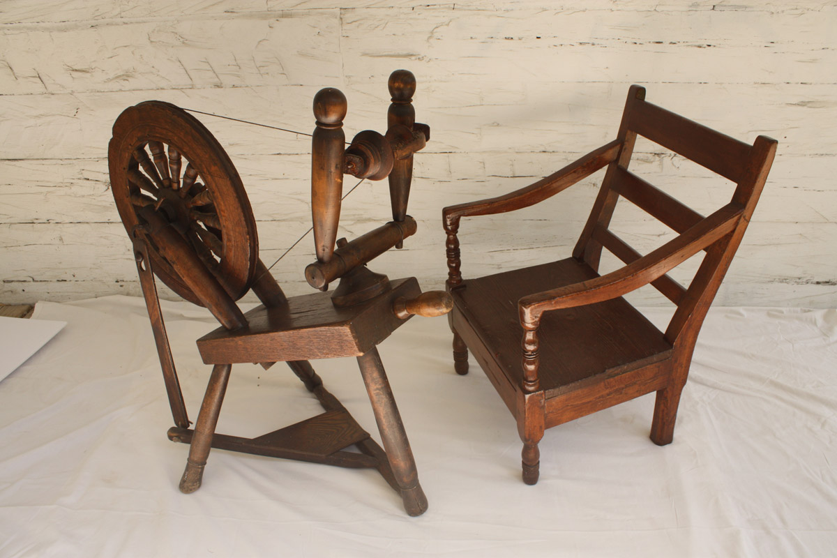 Spinning wheel & slat-backed armchair